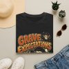 5957970966356086487_2048.jpeg T-Shirt — "Grave Expectations" Halloween Skull & Tombstone Tee